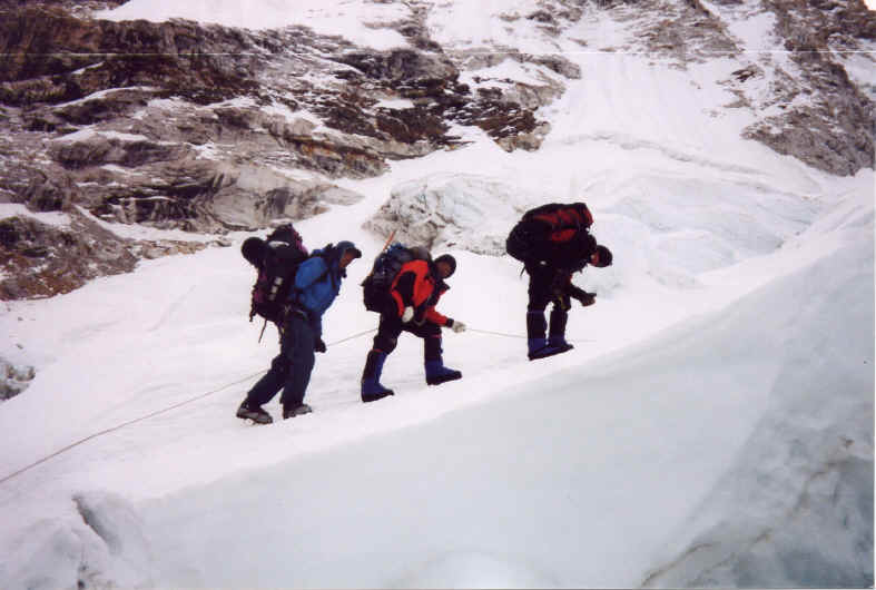 Sherpas carrying heavy loads up Mt. Everest