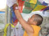 stringing the flags at the Stupa.JPG (198091 bytes)